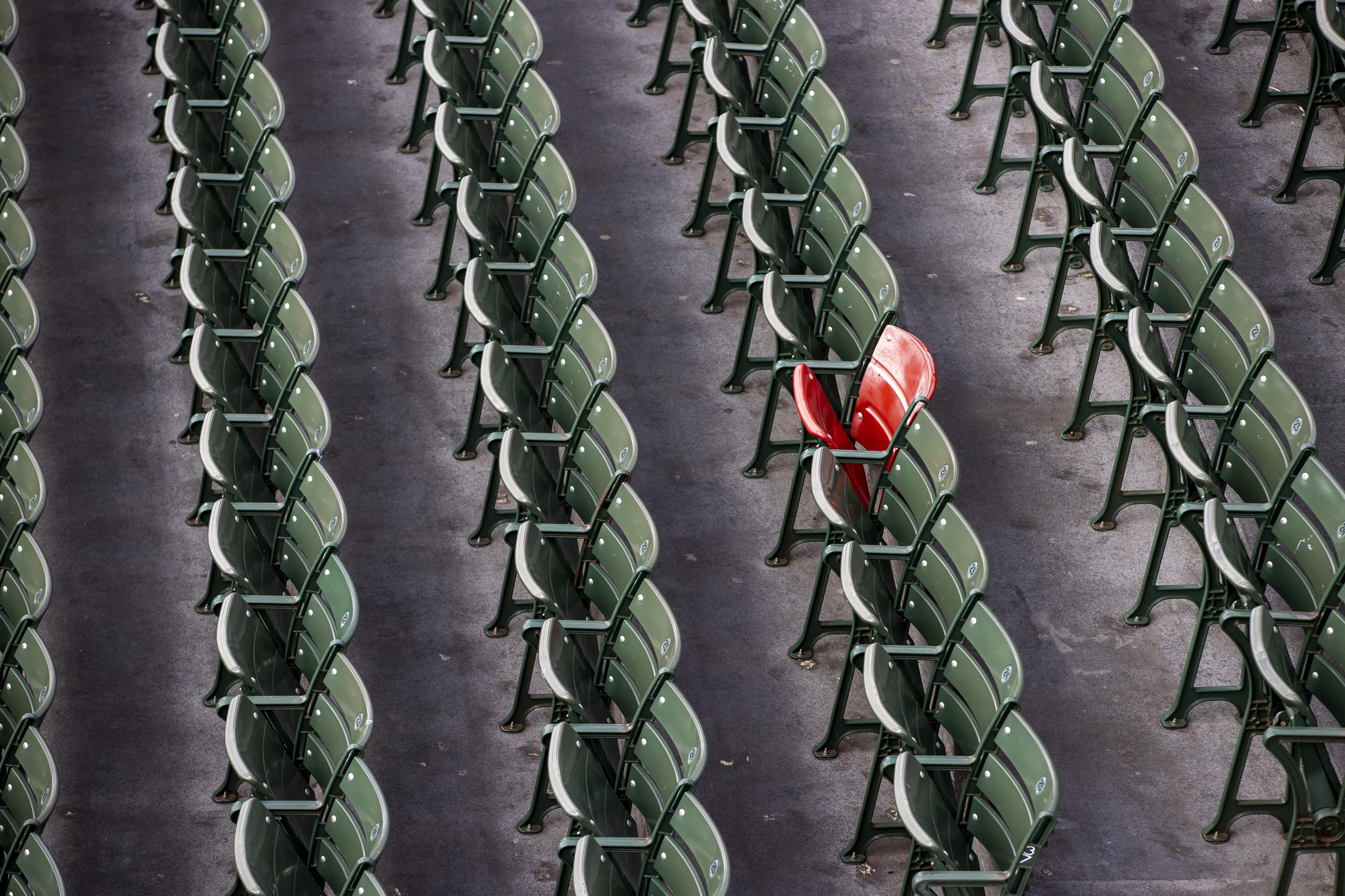 BOSTON, MA - APRIL 16: The red seat, which celebrates the longest home run hit in Fenway Park by Ted Williams, in the bleachers on April 16, 2020. Fenway Park in Boston remains closed during the coronavirus emergency. (Photo by Stan Grossfeld/The Boston G